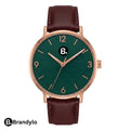 Elegant women's wristwatch with a dark green dial, rose gold case, and brown leather strap.
