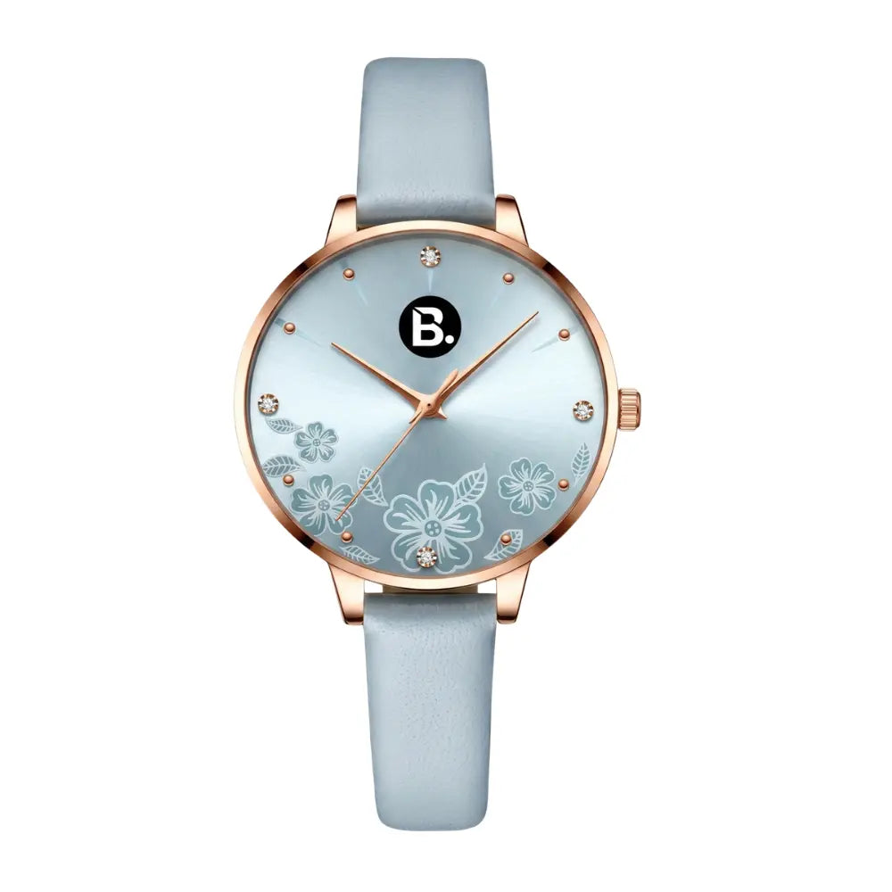 Elegant rose gold women's watch with light blue leather strap and floral dial design.