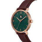 Rose gold wrist watch with a deep green dial and brown leather strap