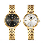 Two elegant gold women's wristwatches with black and white minimalist dials.
