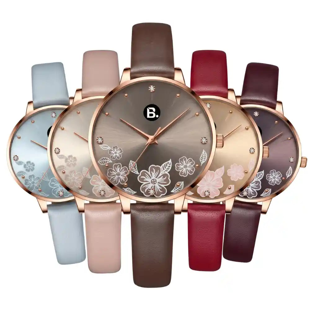 Assorted women's rose gold watches with floral dial designs and leather straps.