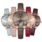Assorted women's rose gold watches with floral dial designs and leather straps.
