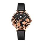 Elegant rose gold women's watch with black dial and floral design on a black leather strap.