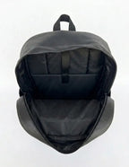 Open black backpack showing spacious interior compartment and organizer pockets.